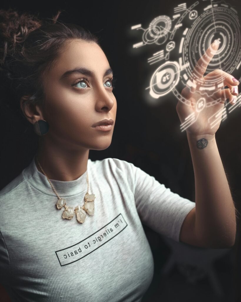 Woman in a modern setting interacting with a holographic user interface. Futuristic concept.