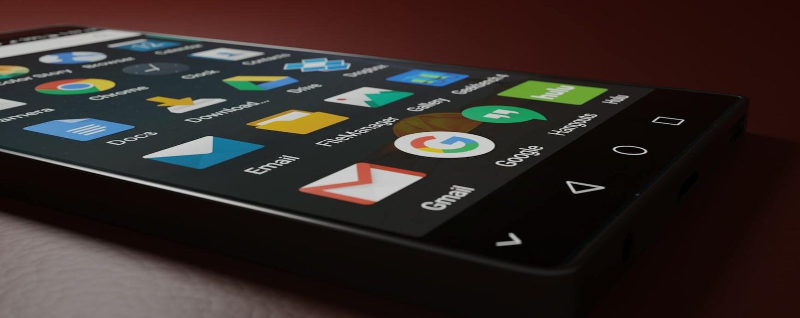 pexels-photo-833337-833337 Close-up of a smartphone displaying various app icons in a low-light setting.